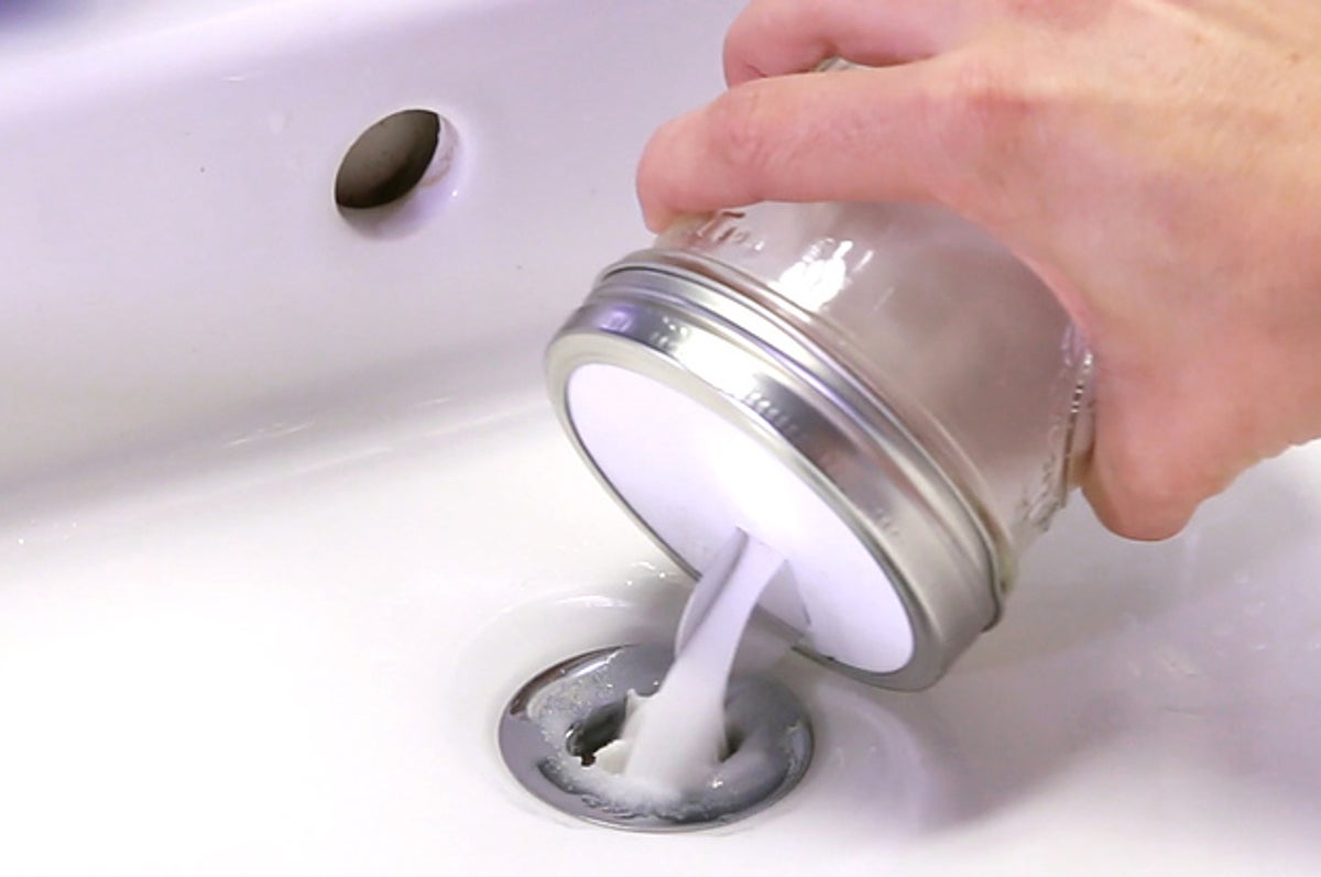 Put chemical to clear clogged basin