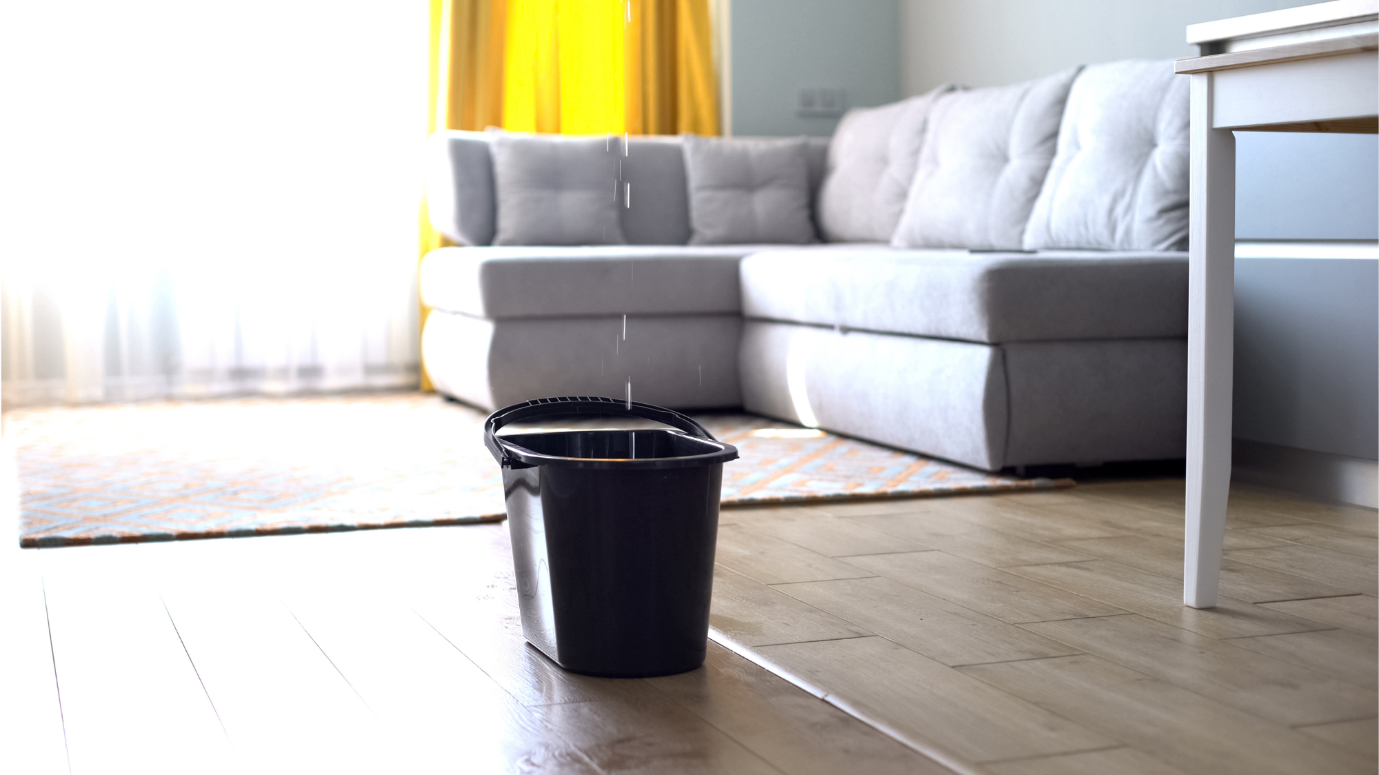 Place a bucket or container to catch any dripping water