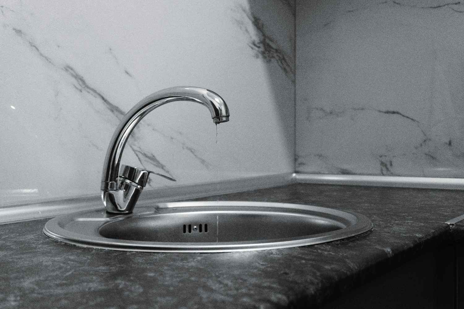 faucet A kitchen tap with water dripping