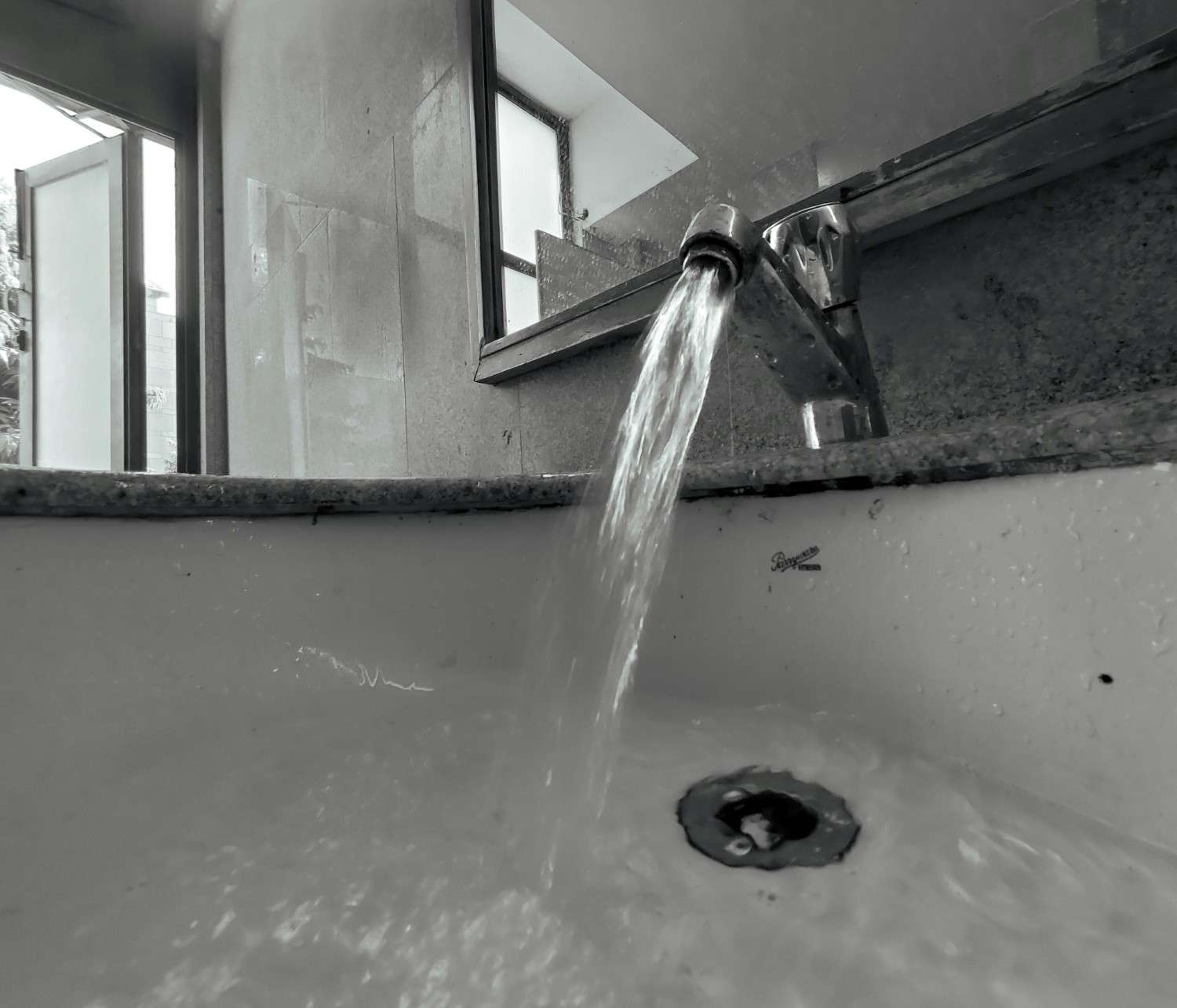 running faucet Strong water coming from a kitchen faucet